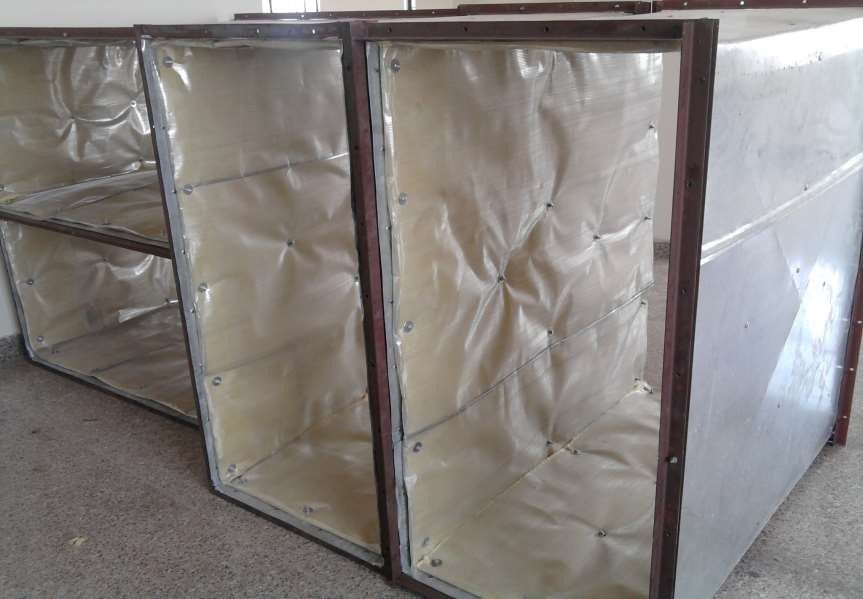 Sections of air-conditioning duct lined on the inside with acoustic insulation