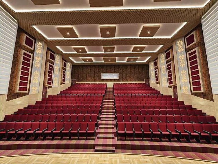 Design visualisation of a raked auditorium with red seats, a central stepped aisle, a coffered ceiling and ornamental wall panels