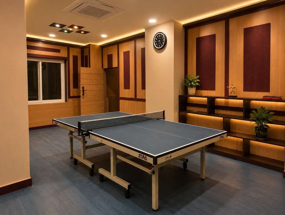 Table tennis table in the AIS Residency games zone with fabric wall panels and lit shelving